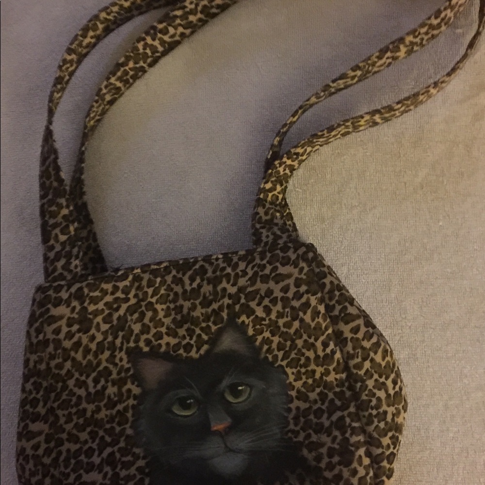 Purse with leopard print and kitty portrait.